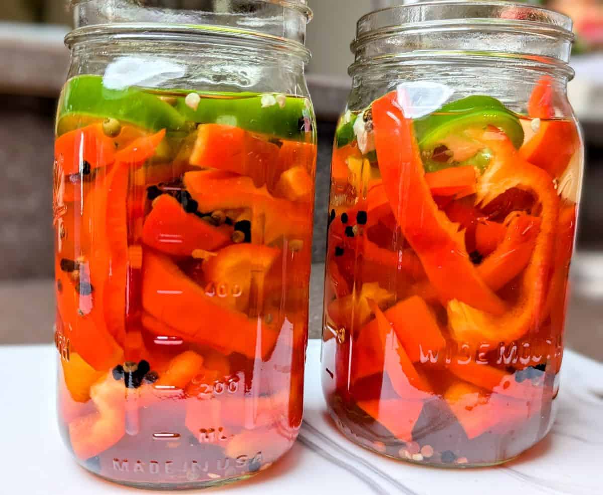 pickled red peppers in mason jars