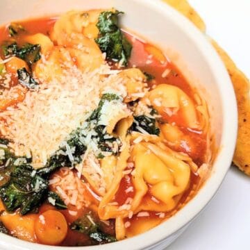 cheesy tortellini soup in bowl
