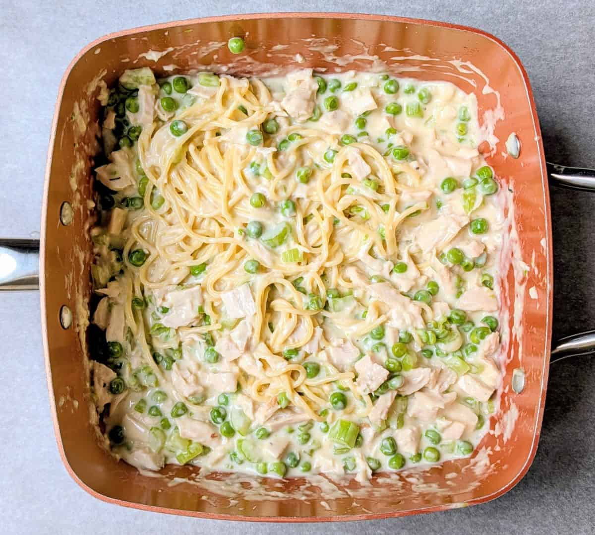 cooked noodles and turkey added