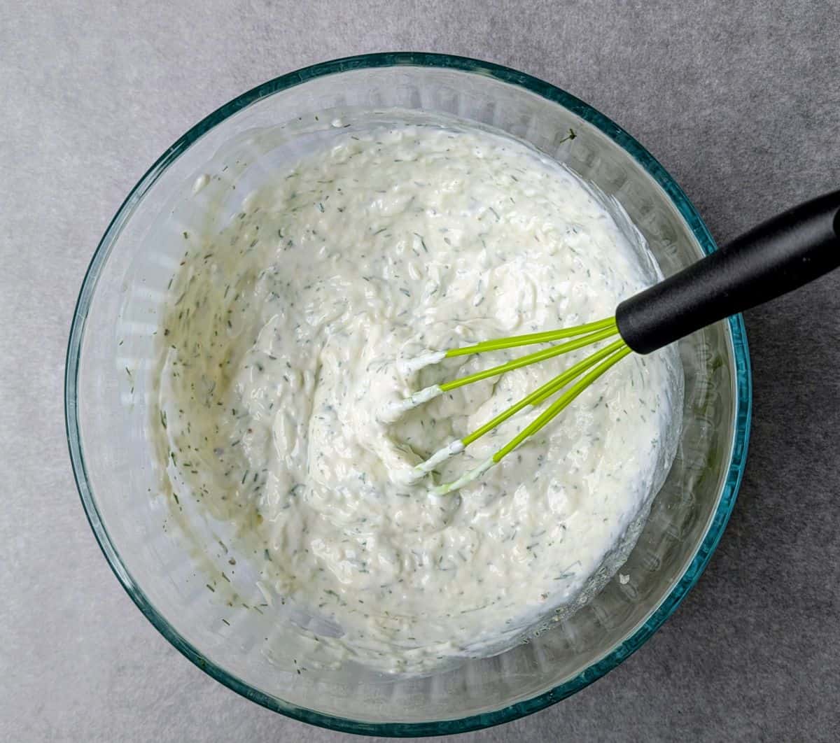 whisking in yogurt, dill, and seasonings