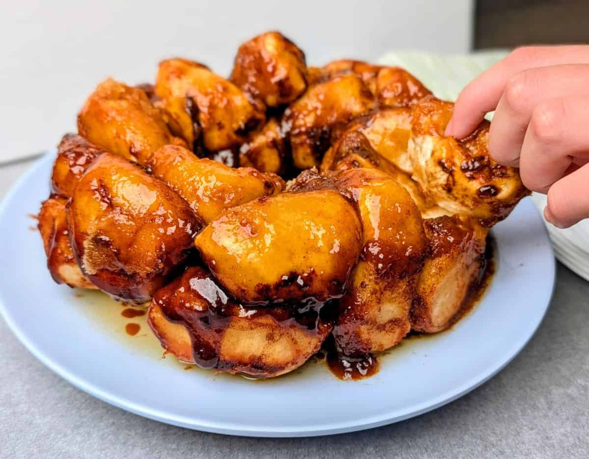pulling off a piece of monkey bread
