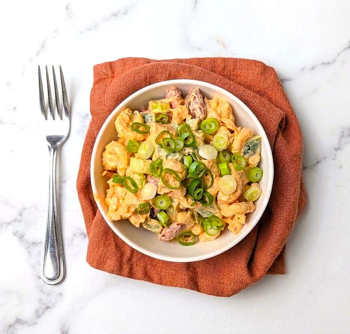 spicy cajun macaroni salad in serving bowl