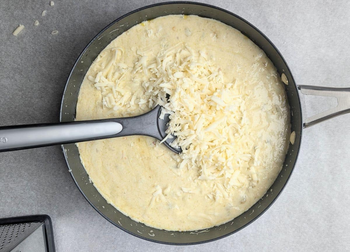 stirring in cheese