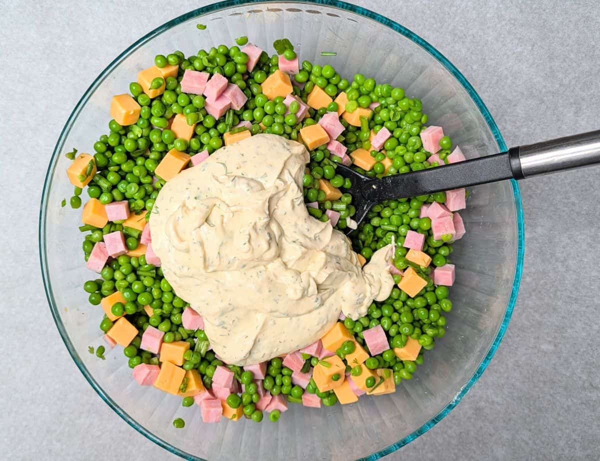adding dressing to bowl