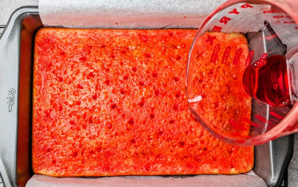 pouring jello syrup into holes