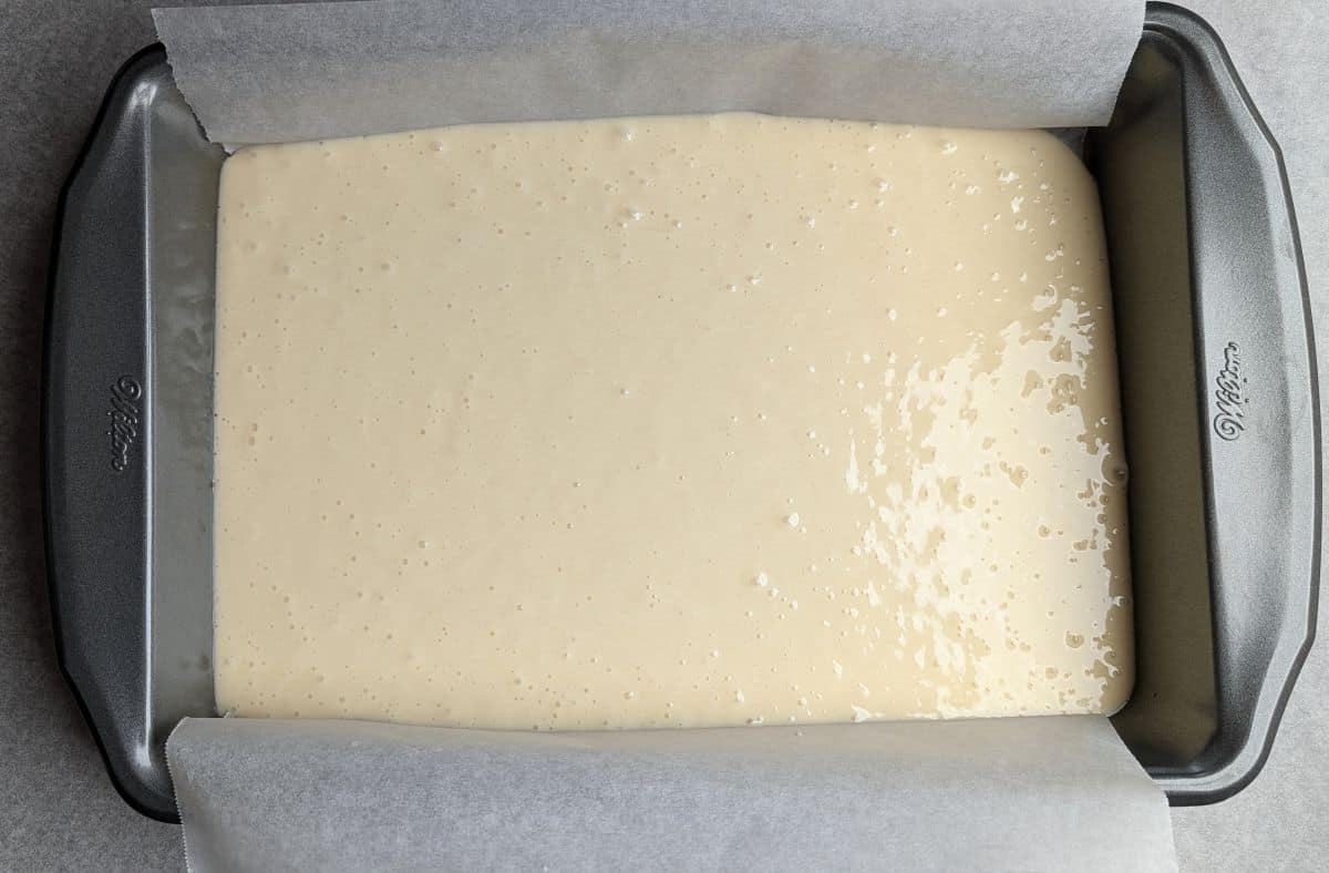 white cake batter in pan