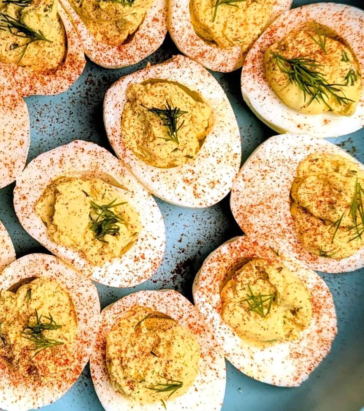dill pickled deviled eggs in serving bowl