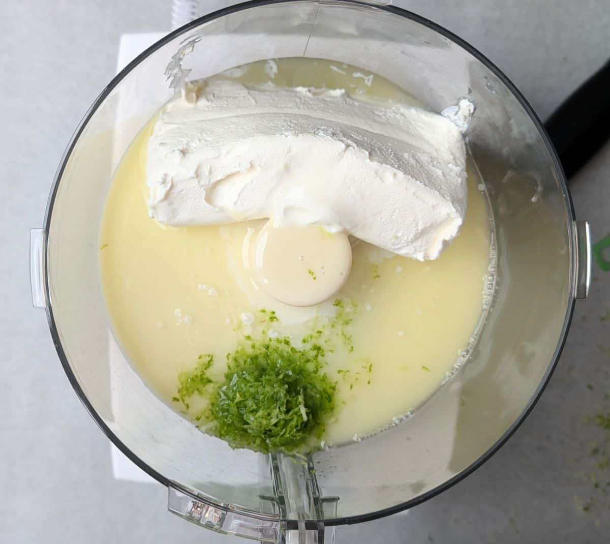adding ingredients to food processor