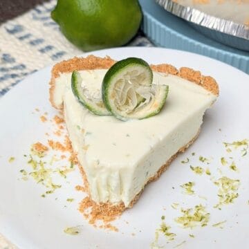 slice of key lime pie on plate with zest