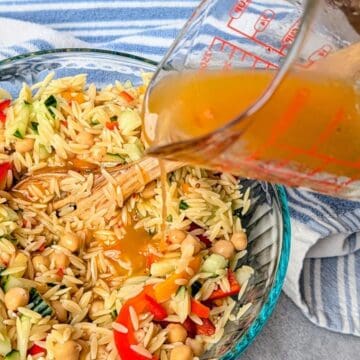 mediterranean salad dressing being poured