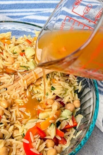mediterranean salad dressing being poured