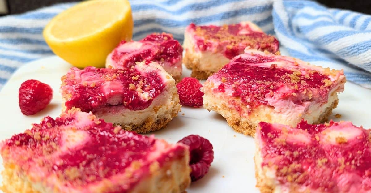 bars on tray with lemon and raspberries