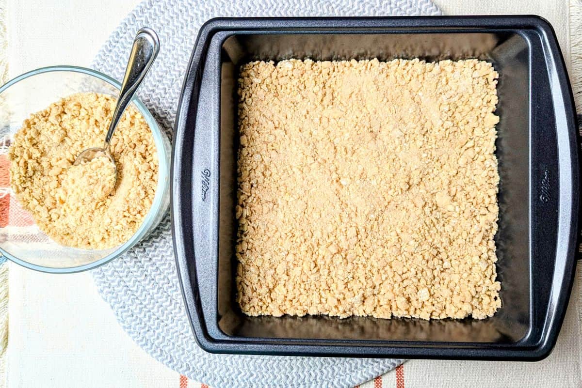 spreading chex crumble into 8x8 pan