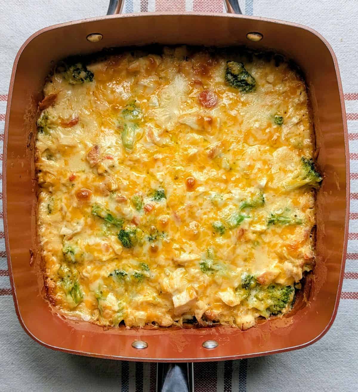 casserole baked in pan with gooey cheese crust on top