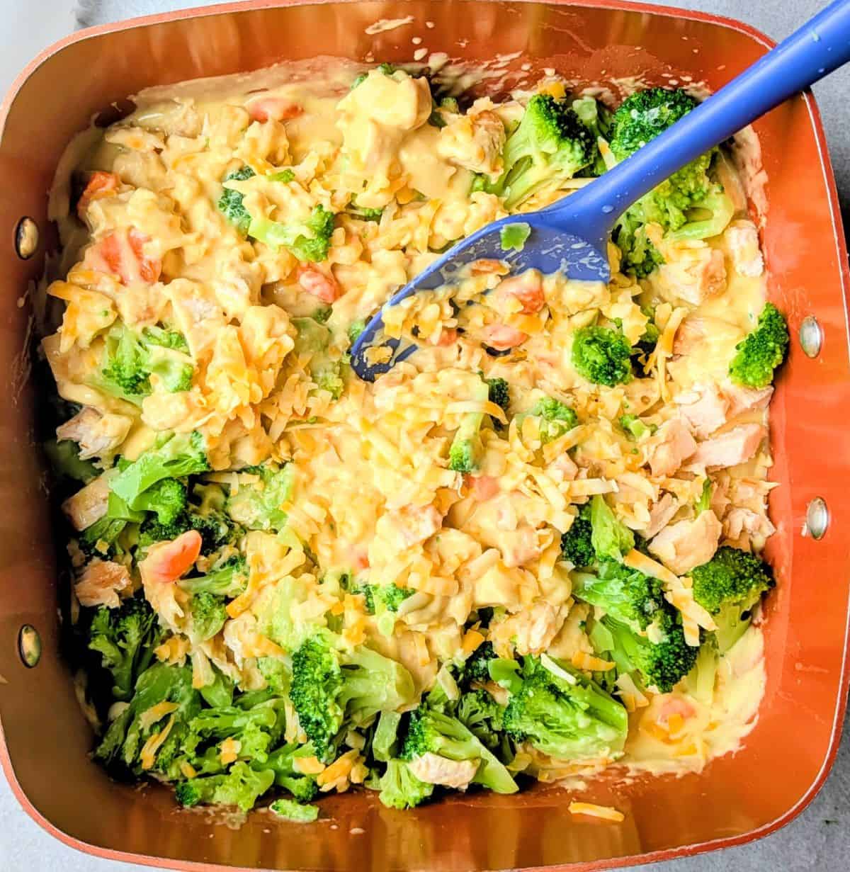 stirring in defrosted broccoli