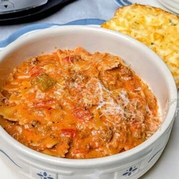 crock pot lasagna soup serving in bowl with bread
