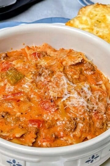 crock pot lasagna soup serving in bowl with bread