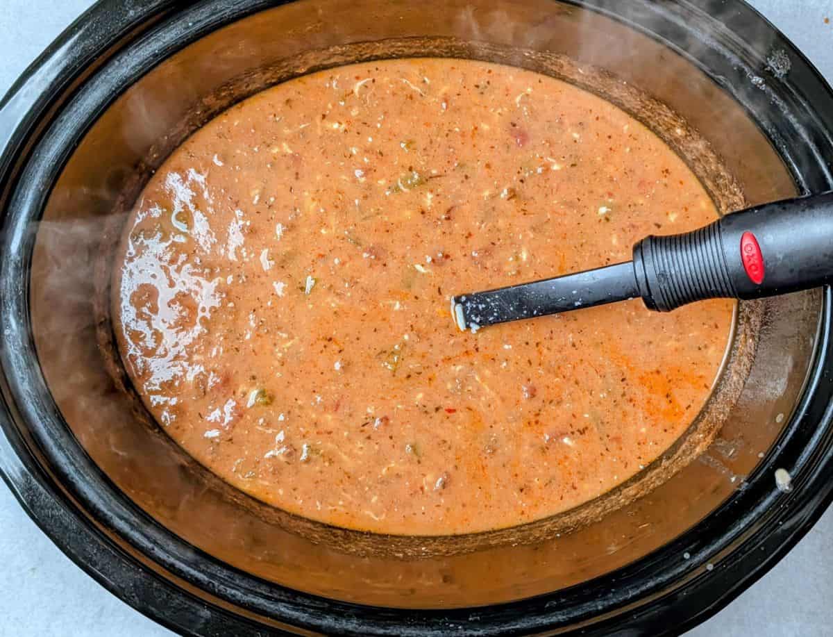 stirring in cream cheese and half of the mozzarella