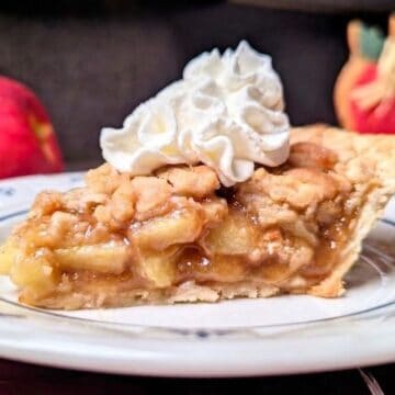 apple crumb pie on plate with whip