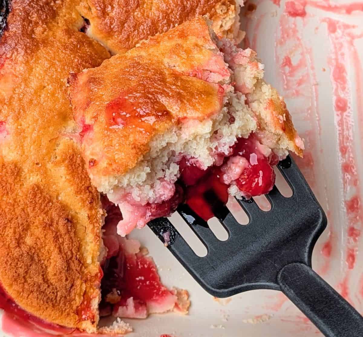 lifting cake out of pan with spatula