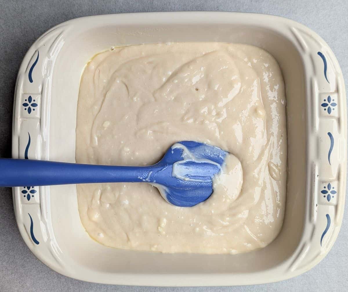 spreading cake batter into pan