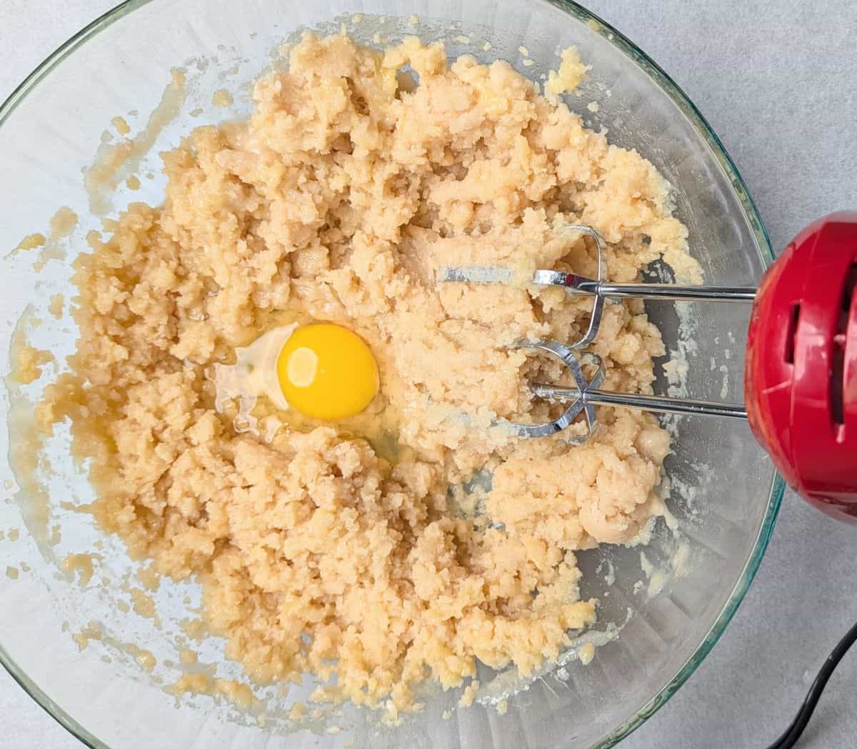 adding eggs to cake batter
