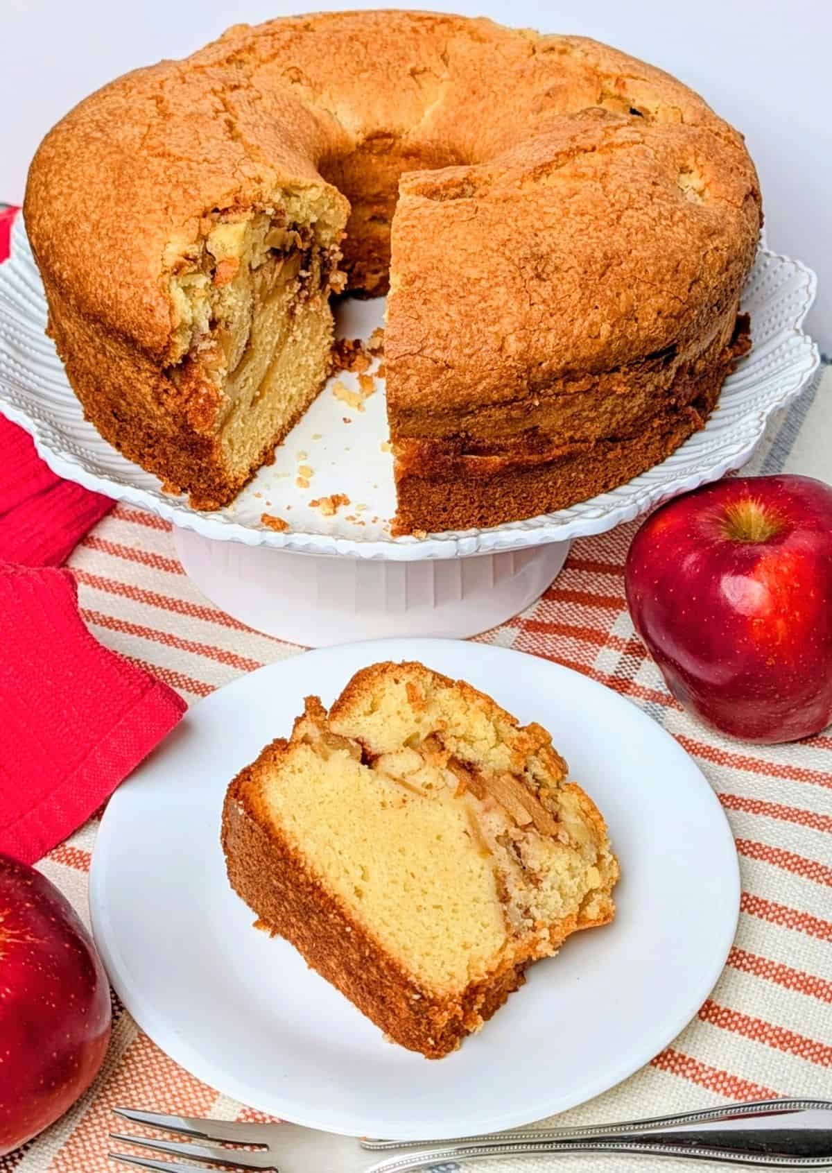 cake on serving plate with slice cut to see apples