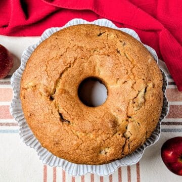 whole jewish apple cake on serving plate