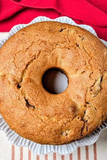 whole jewish apple cake on serving plate