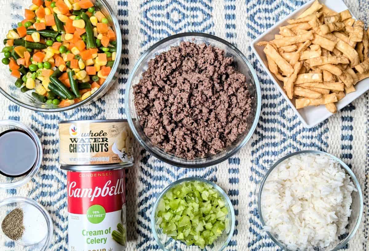 ingredients for casserole, including ground beef, rice, veggies, soy sauce