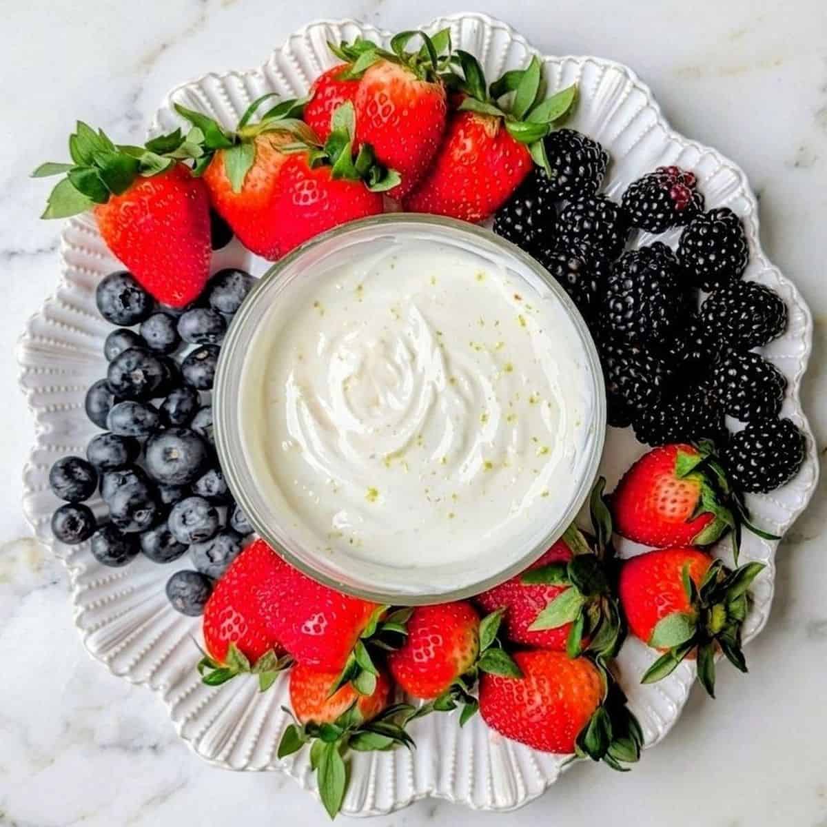 greek yogurt fruit dip in center of fruit tray