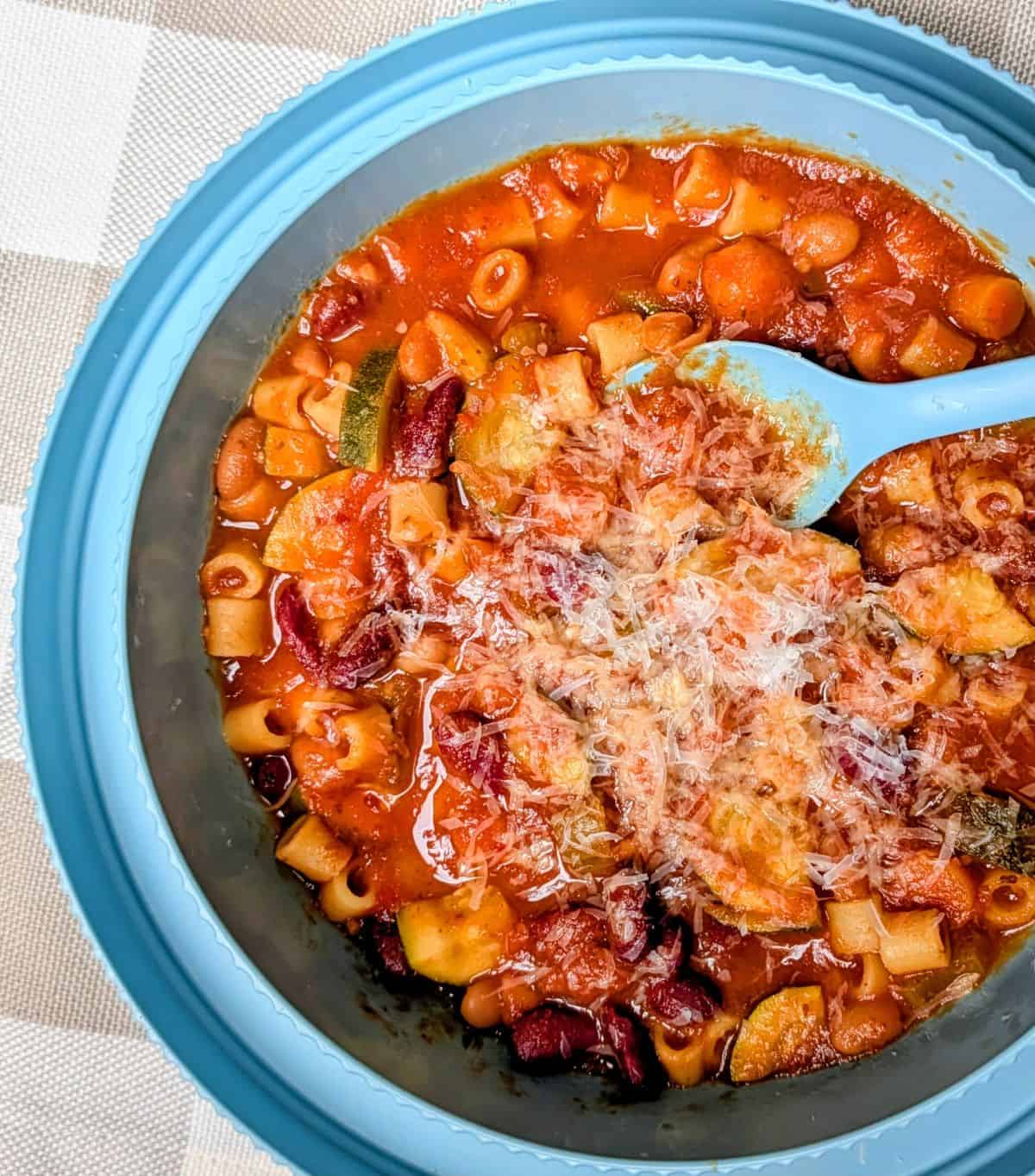 serving in bowl with freshly grated parmesan cheese