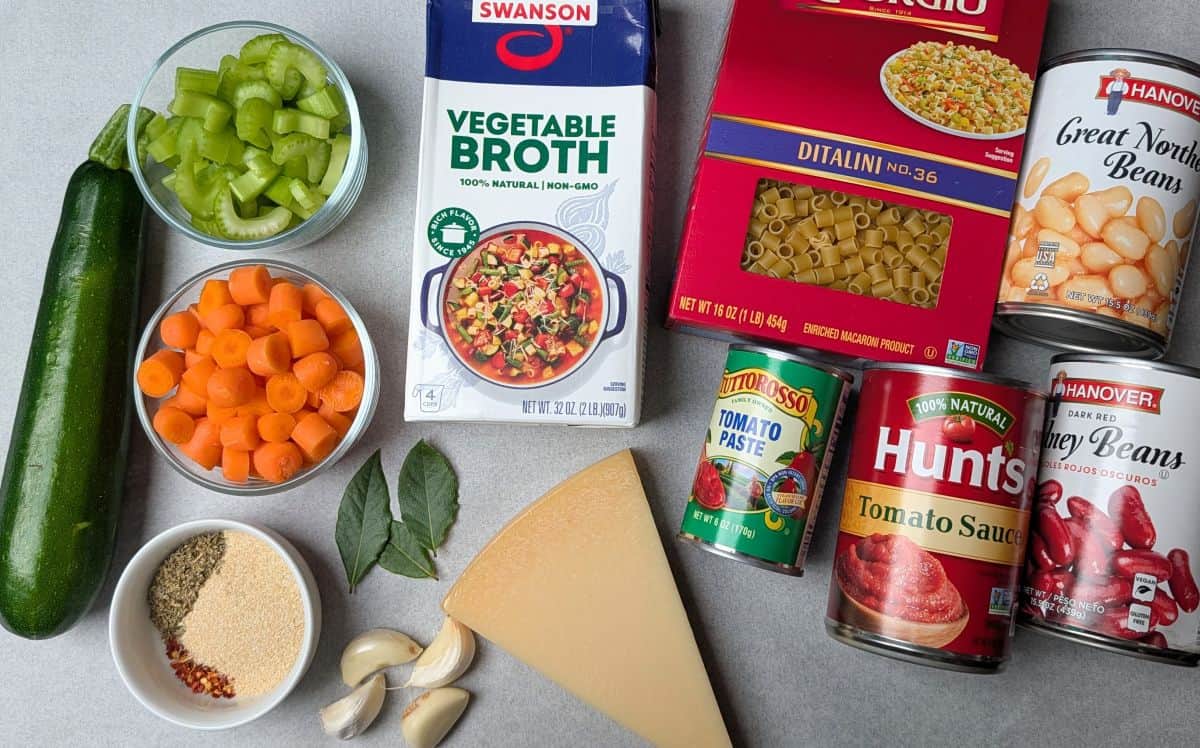 ingredients for the souo, including ditalini, zucchini, beans, carrots, parmesan